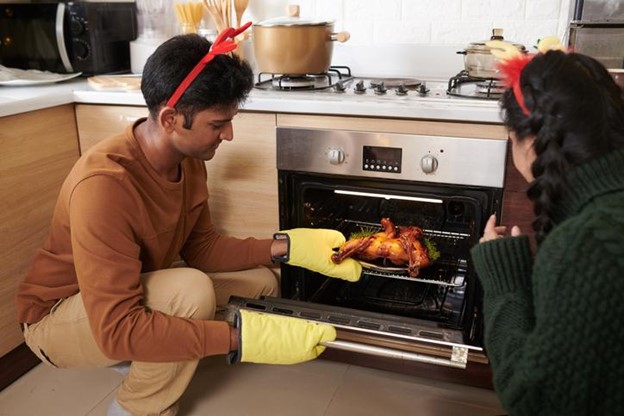 Couple cooking Christmas dinner.