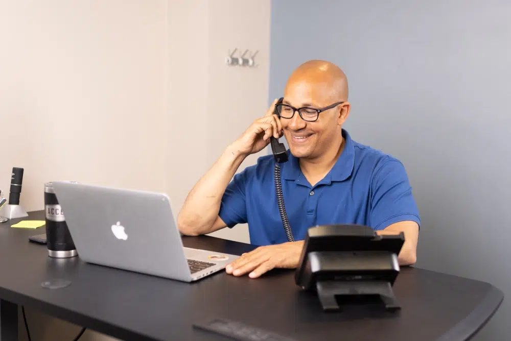 Accel Pest employee taking phone calls.